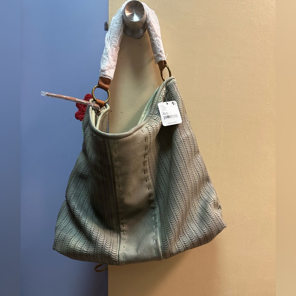 Free People shoulder bag in the color moss.